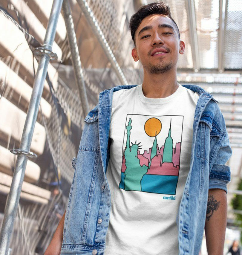 A young man wearing a t-shirt with an eco-friendly image of the statue of liberty.