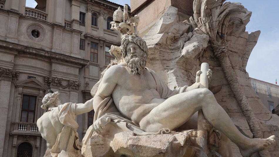A statue in front of a building.