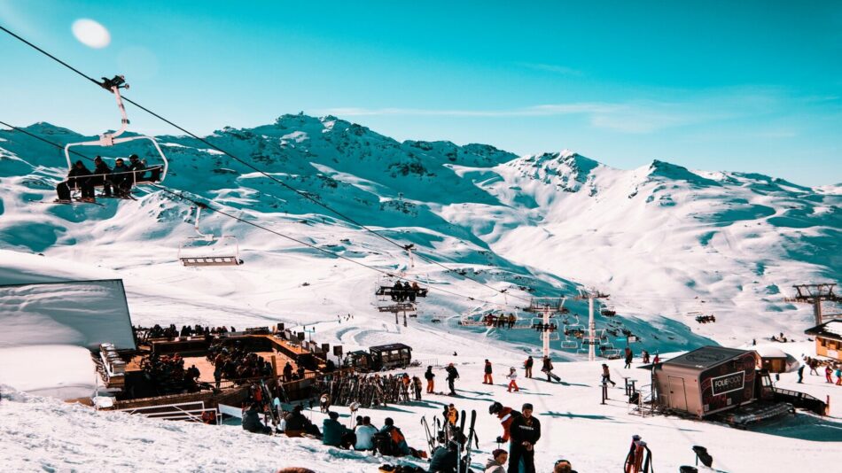 A group of people enjoying the slopes at one of the best ski resorts in Europe.
