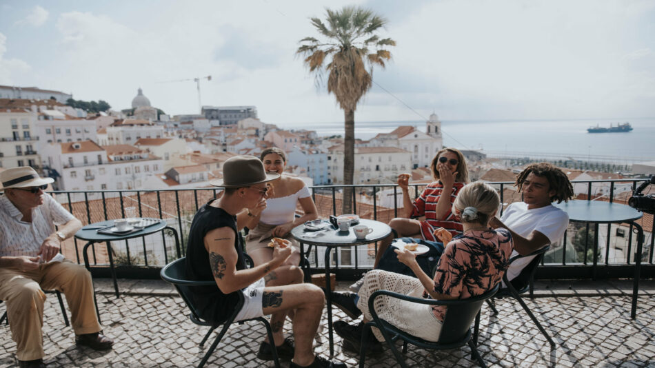 young people at a table in lisbon, portugal
