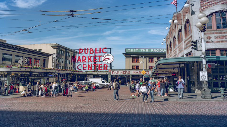 A bustling city street with a lot of people walking around, reminiscent of popular Grey's Anatomy destinations.