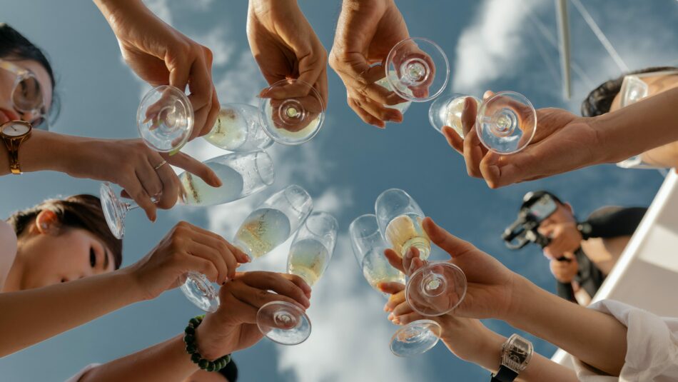 group of friends celebrating at sea