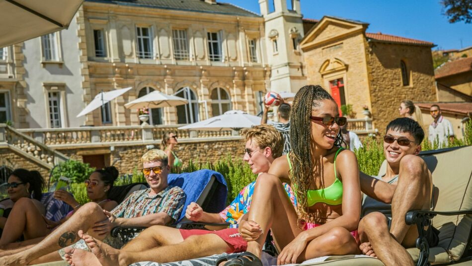 travellers relaxing by French Chateau