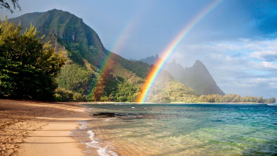 paradise-like beach in Hawaii with double rainbows