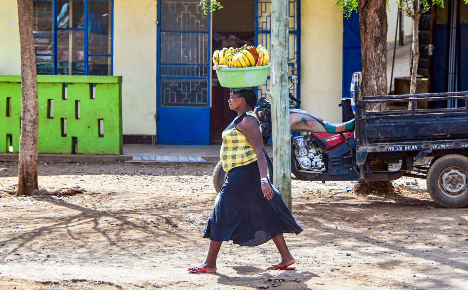 Woman carrying fruit