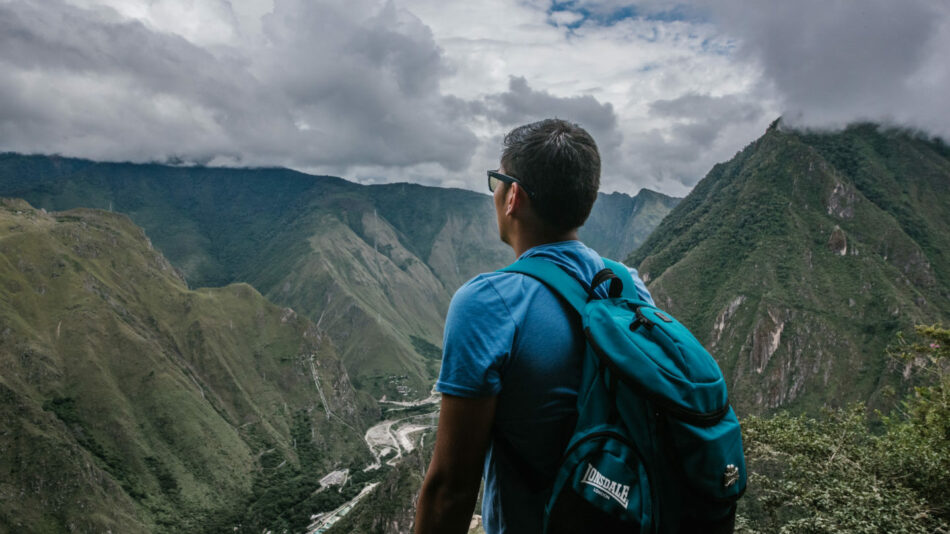 man overlooking machu picchu