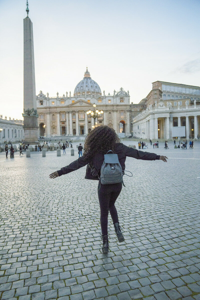 girl walking on cobbles in rome