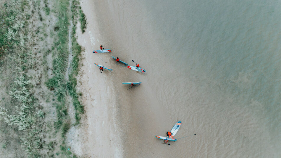 Friends paddleboarding