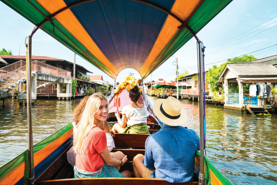 Friends on boat in Asia