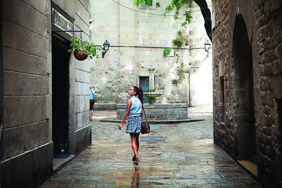 A woman walking abroad.