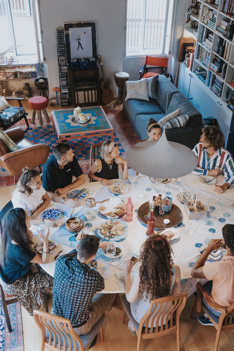 A group of people sitting around a table.