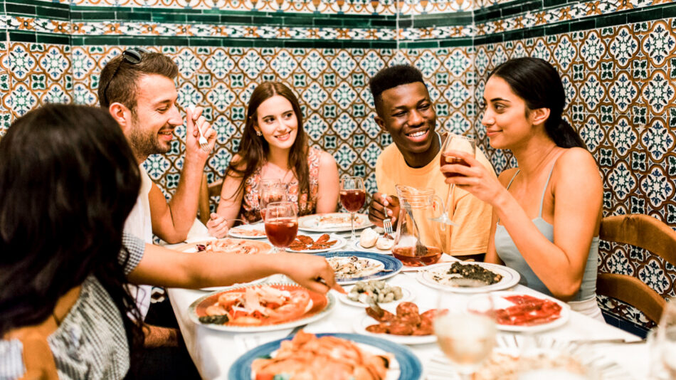 A group of friends enjoying a meal in a restaurant.