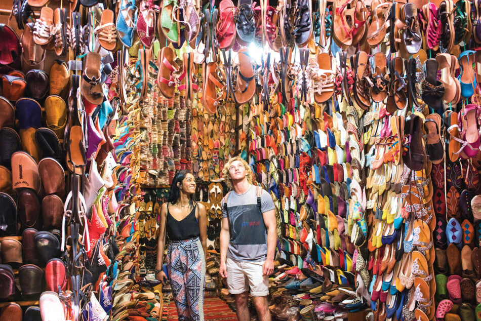 A couple standing in a shoe-filled hallway.
Keywords: couple, shoes