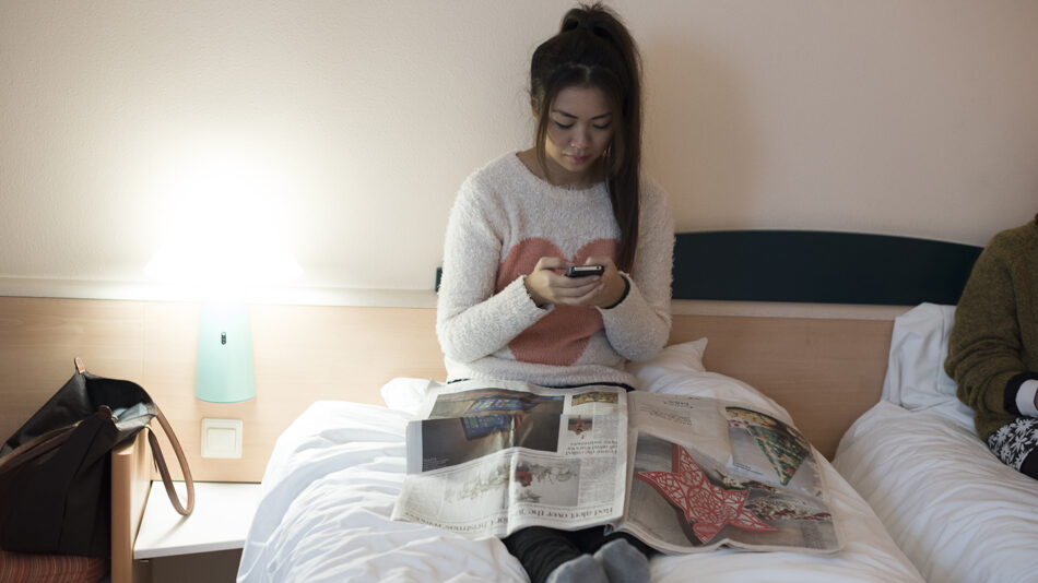 girl-on-her-phone-in-bed