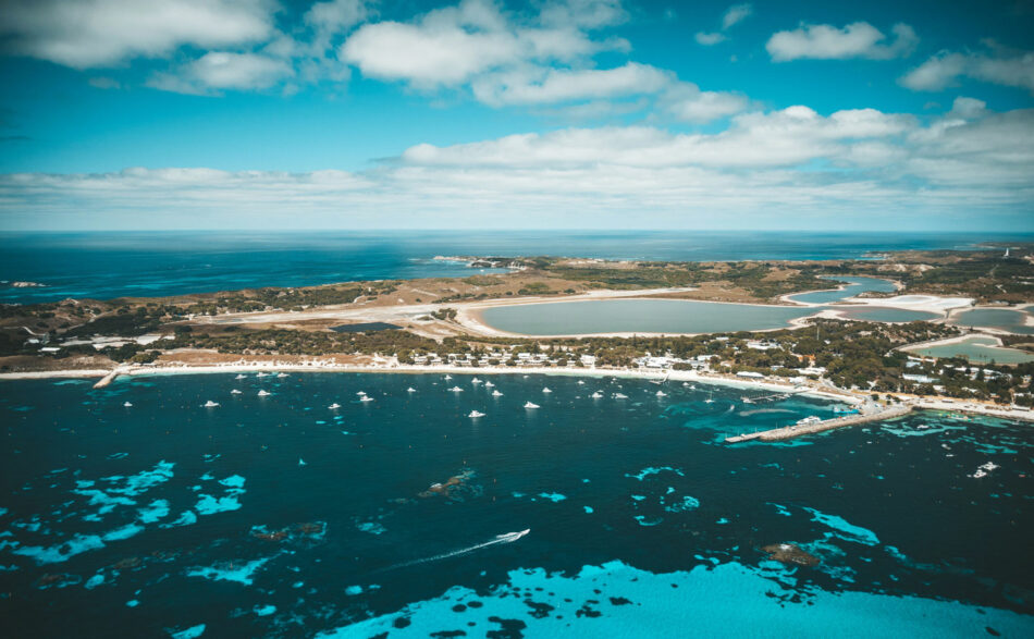 An aerial view of a bay with boats in the water.