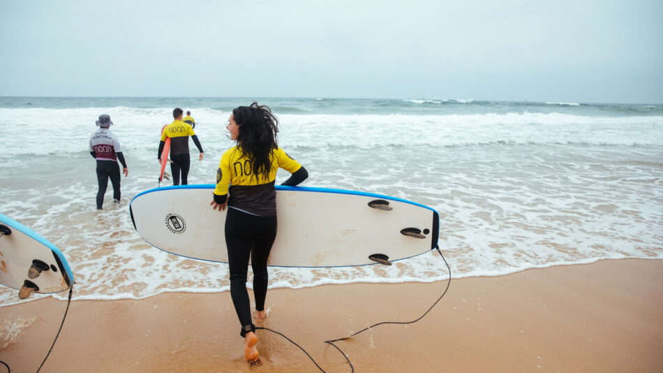 Woman surfing in Portugal