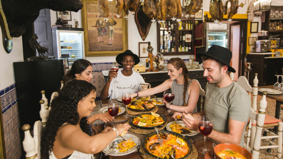 a group eating food - travel apps