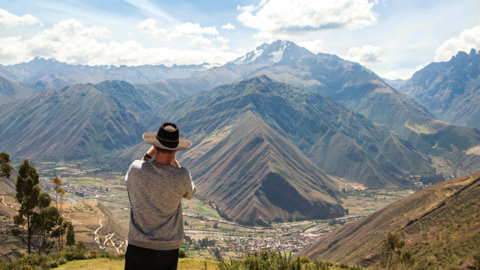 man-taking-photo-mountains-peru