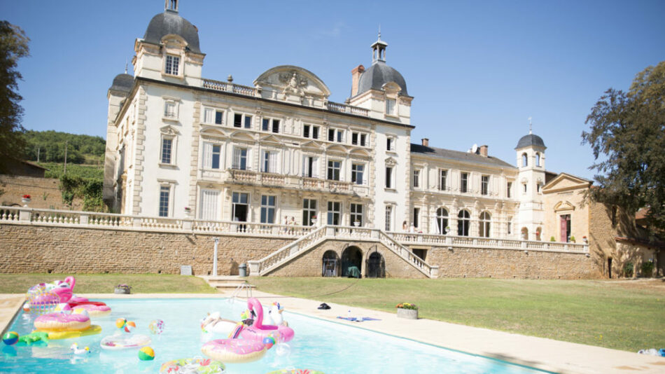 A Contiki trip with a swimming pool in front of a building.