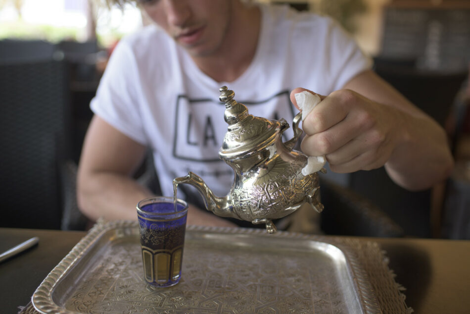 boy pouring tea