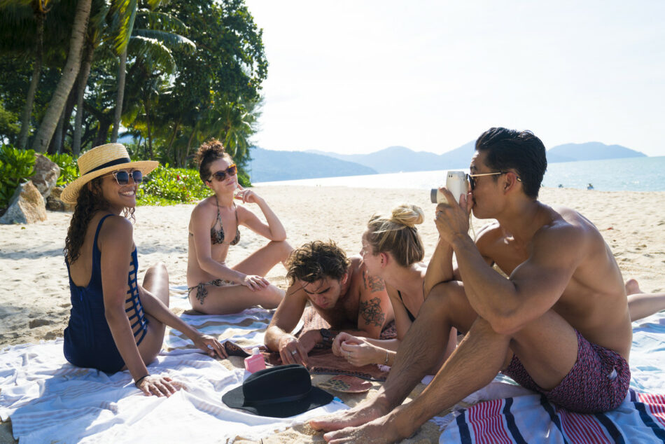 group of travellers on beach