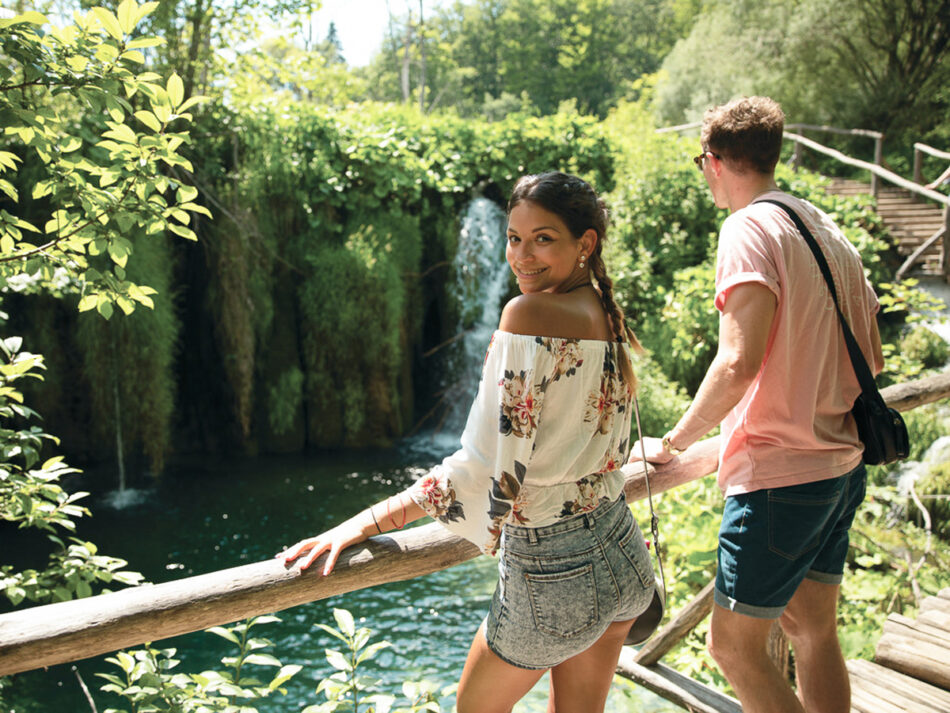 People outside looking at watrerfall