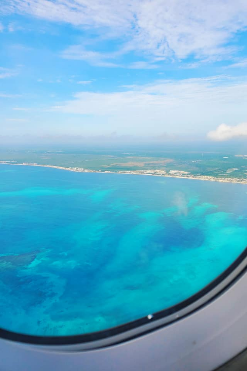 A view of the ocean from an airplane window.