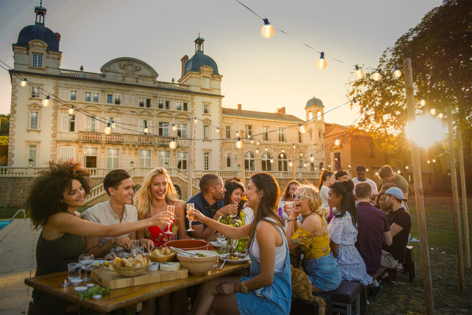 Contiki Chateau, group of friends eating and drinking at dusk