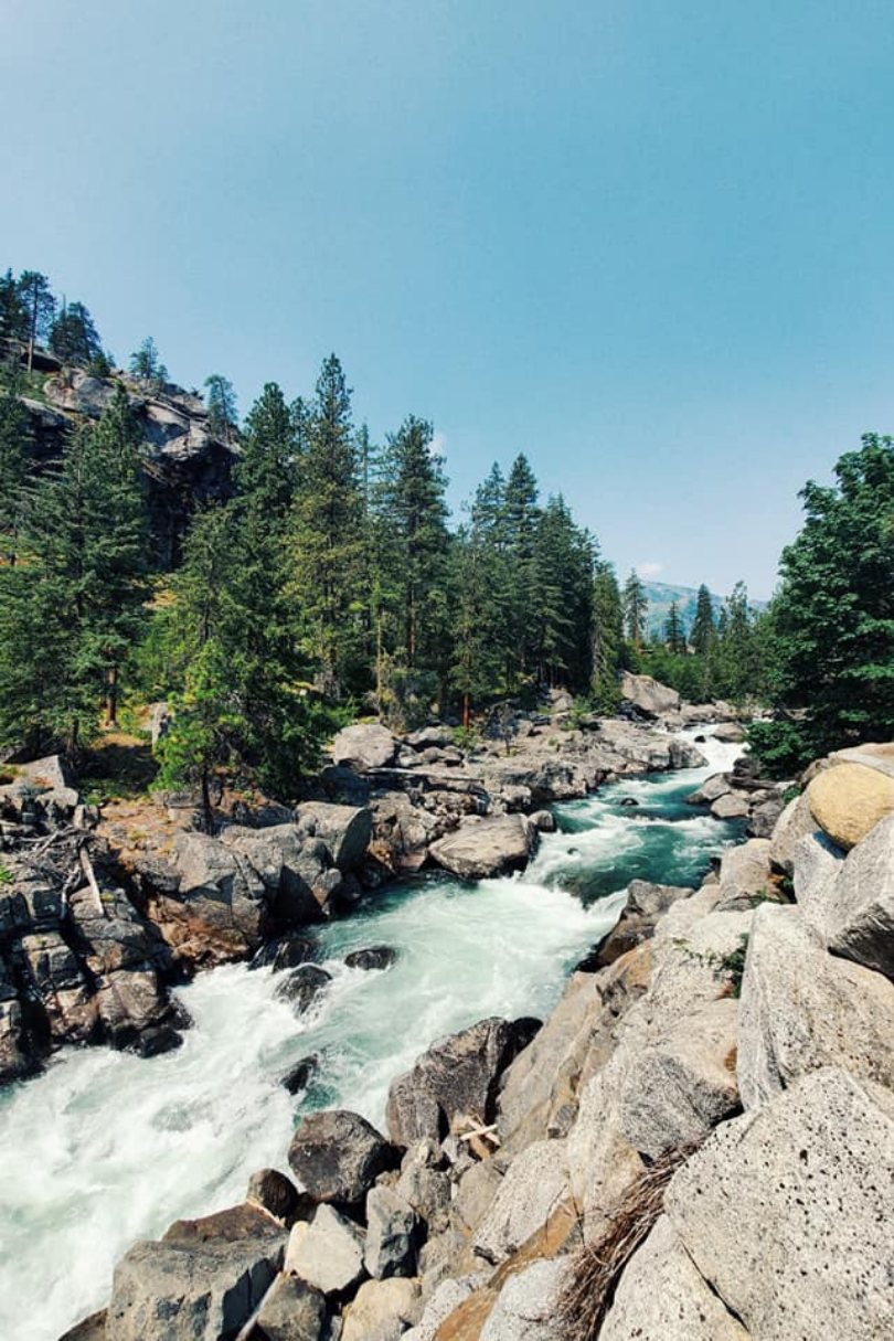 A river surrounded by rocks and trees.