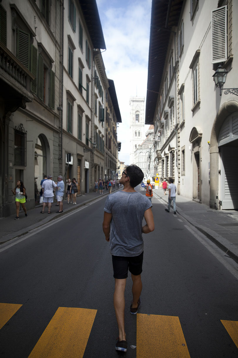 man walking around Florence streets