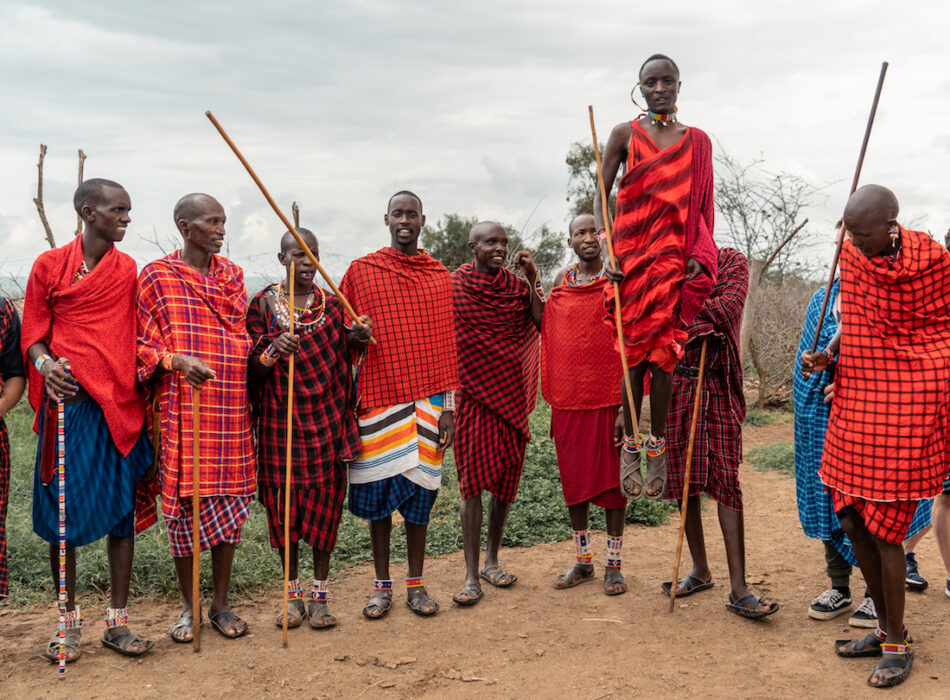 A group of men with sticks.