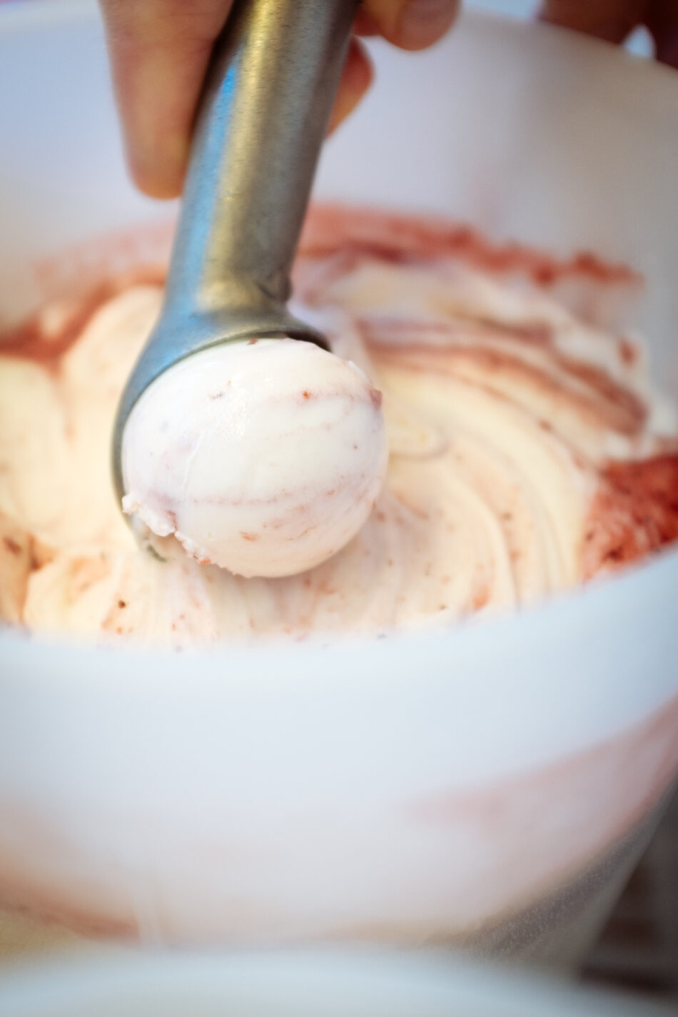 A person mixing ice cream in a bowl in Austin.