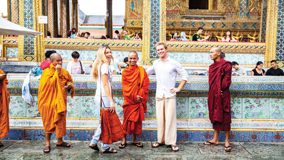 group of travellers with a monk in Bangkok Thailand