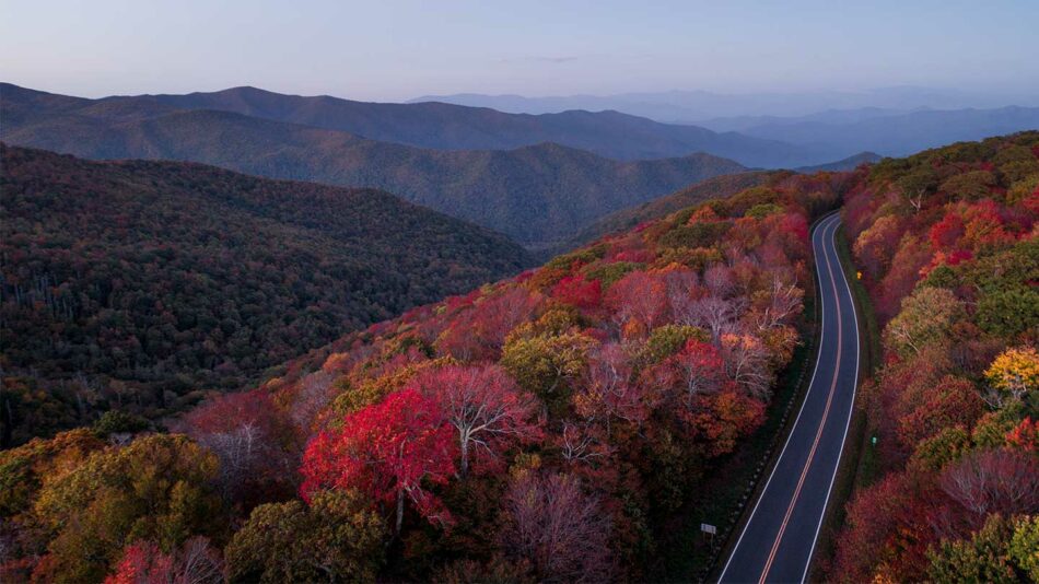 An aerial view of a road in the great Smoky Mountains, one of the 15 best places to visit in October.