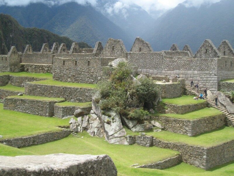 Machu Picchu, a renowned archaeological site, showcases magnificent ruins nestled in the Andes Mountains.