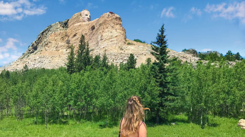 Girl looking at Crazy Horse Memorial mountain carving