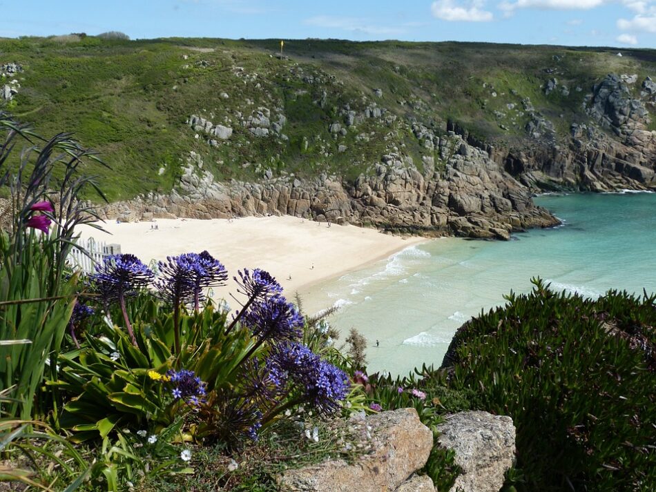 A rocky shore with a sandy beach in the UK.