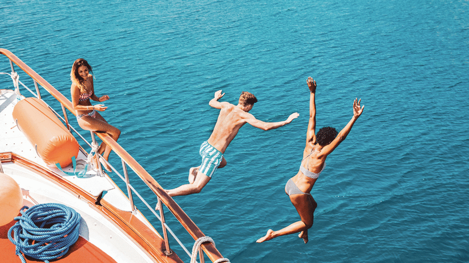 travellers jumping off a boat in Croatia