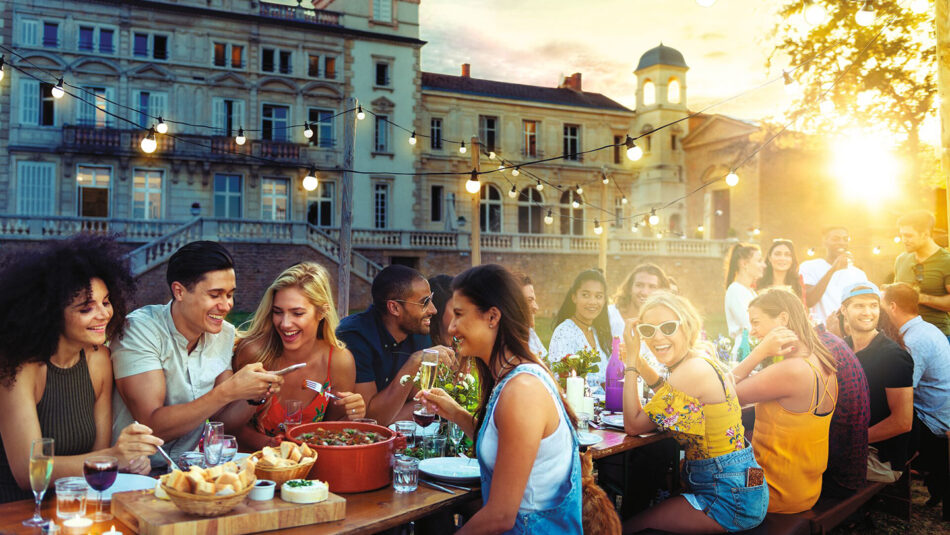 friends eating a meal on a balcony