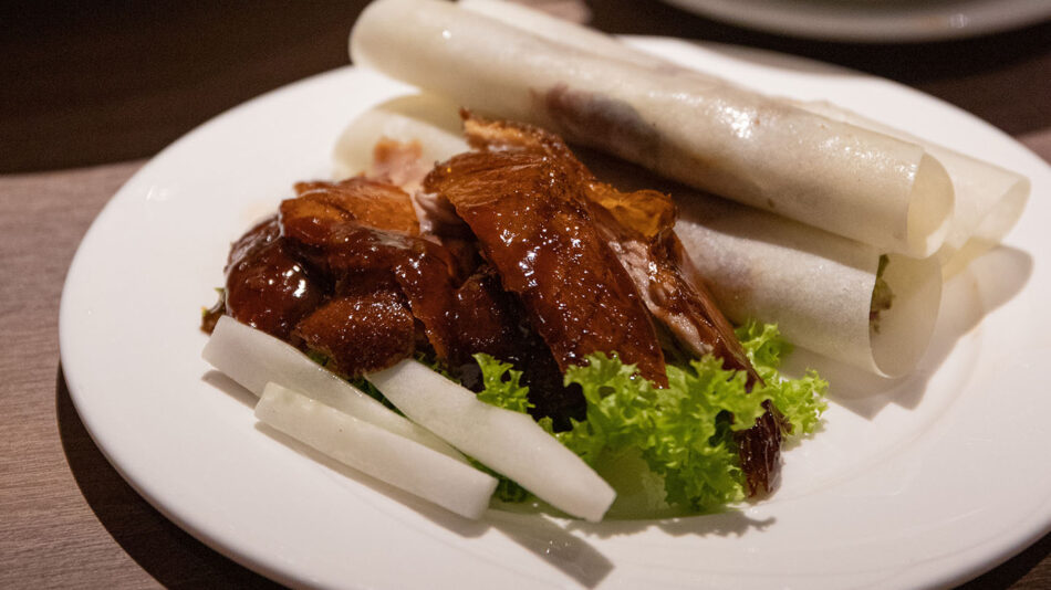 A white plate with a plate of food on it.