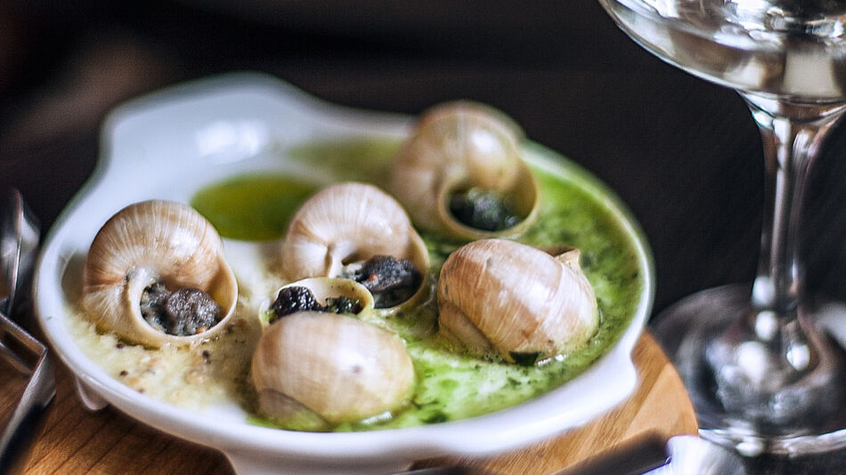 Snails served with garlic and herb butter. A Christmas food in Prague, traditionally