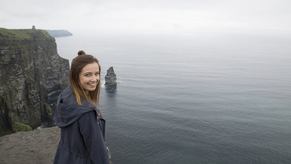 Girl-on-Galway-cliff-Ireland-solo