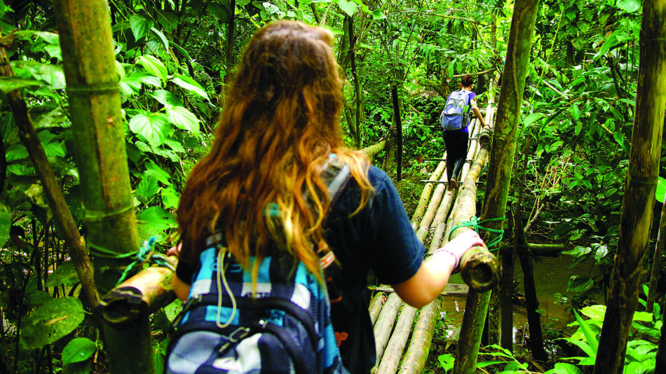 Girl-walking-over-bridge-volunteering