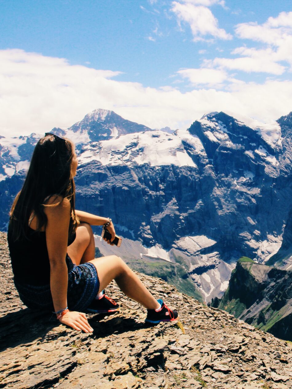 Girl looking onto mountains travel changed life