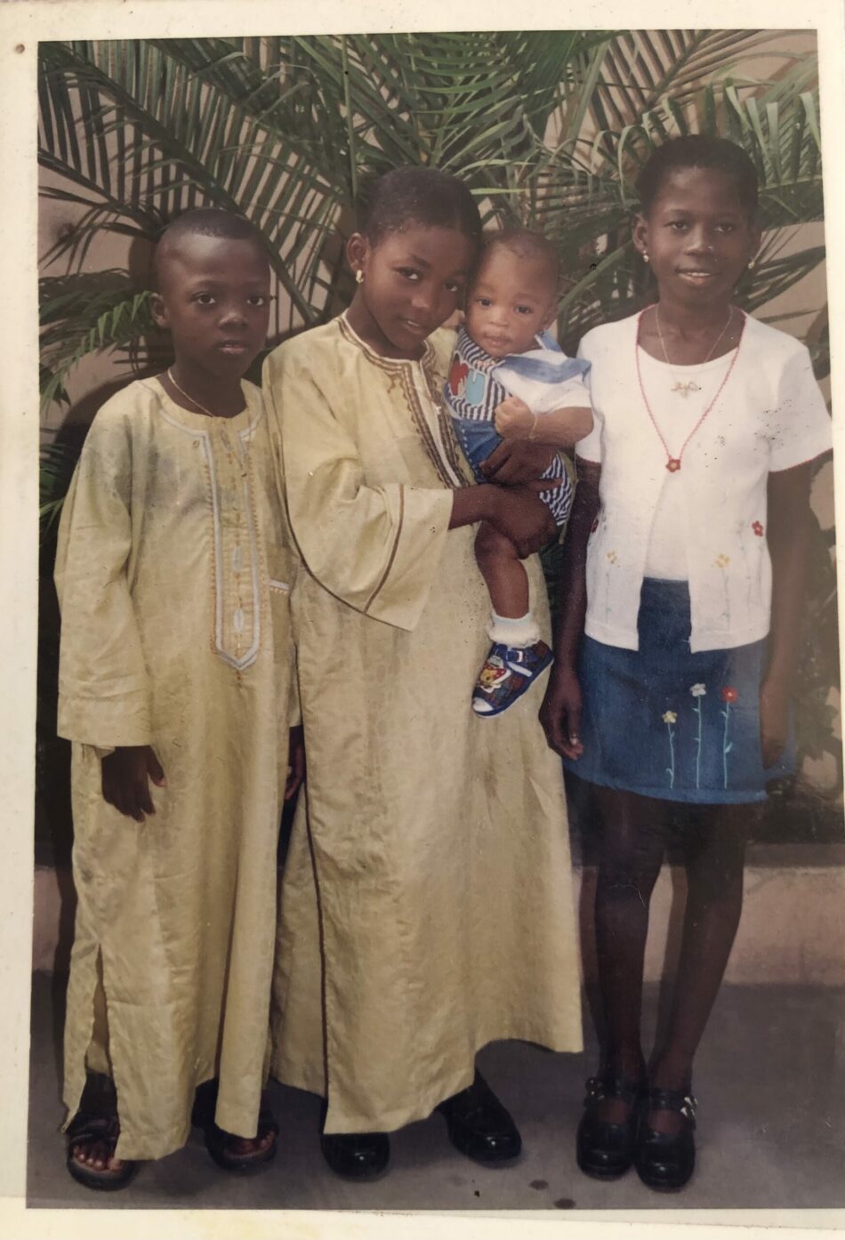 A photo of a group of children posing for a picture.