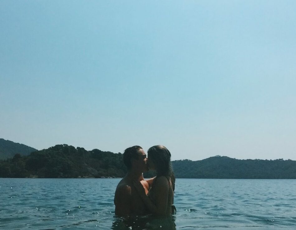 Couple kissing in the sea