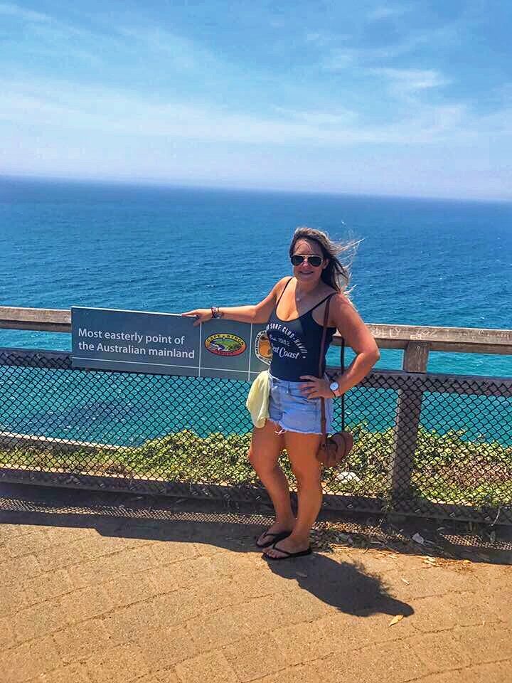 Girl standing in front of water