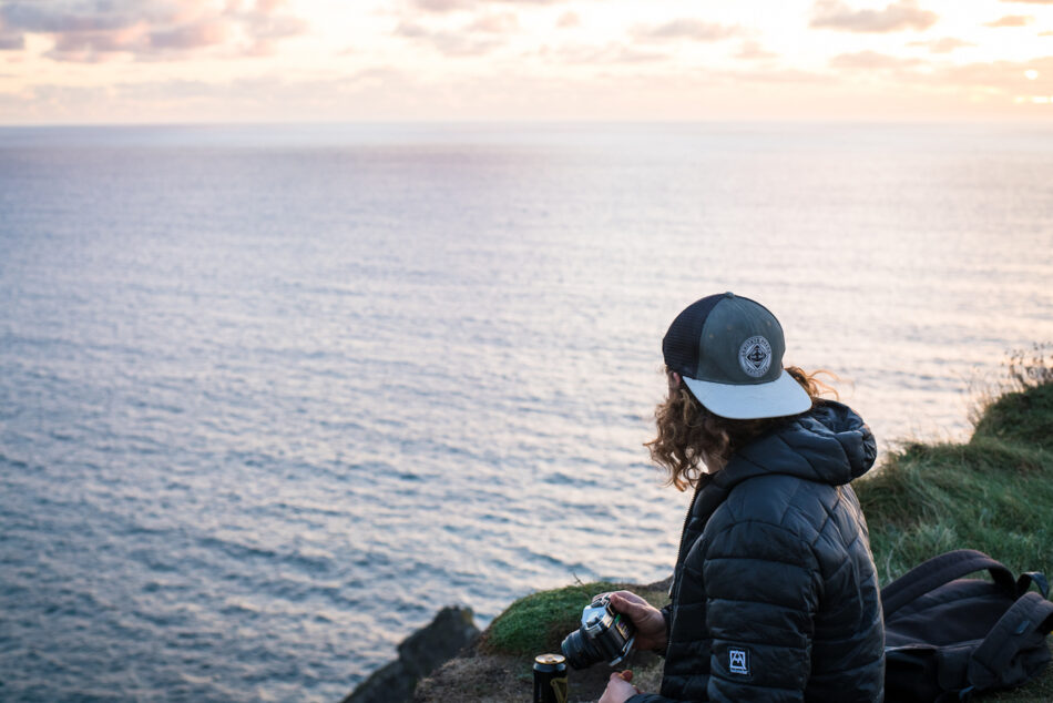 Man looking at Northern Irish coast