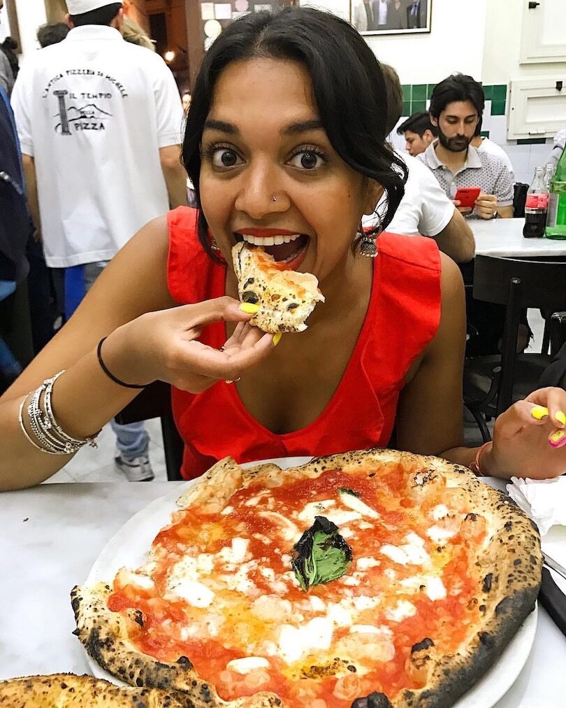 Chef Priyanka in Naples with a margherita pizza