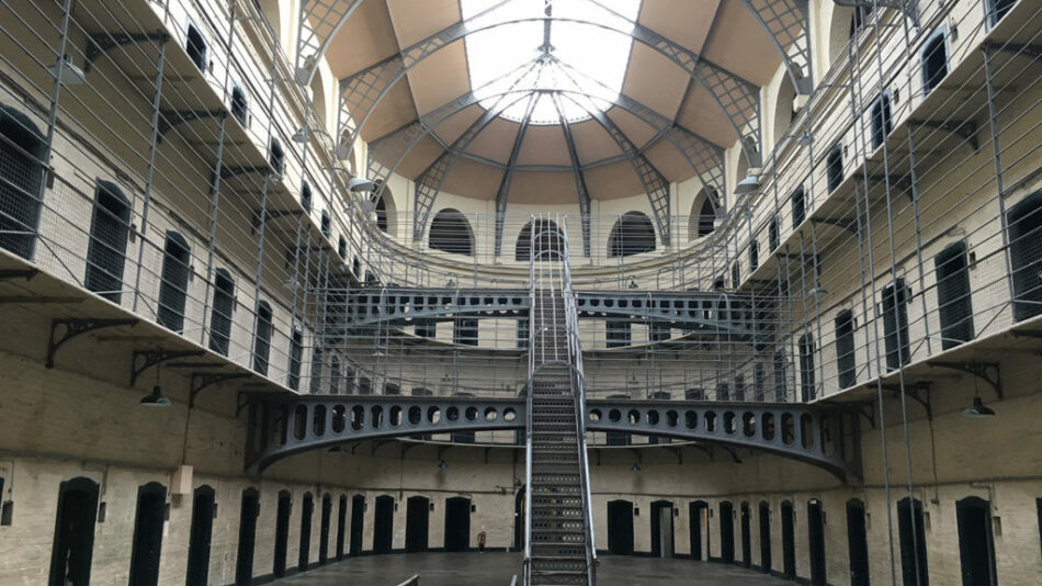 A prison cell in Dublin with a spiral staircase.